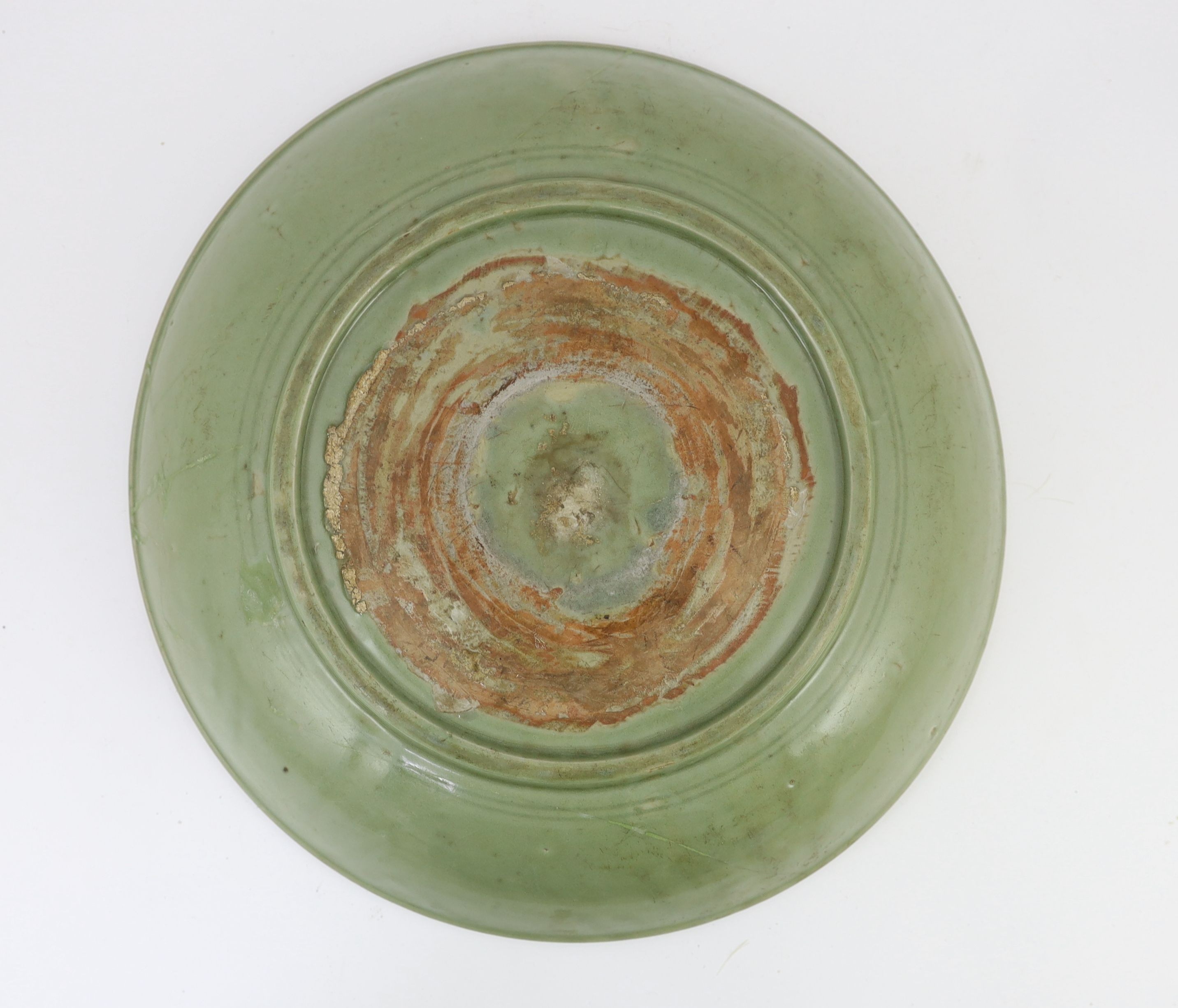 A rare large Chinese Ming Longquan celadon dish, 14th century, 44 cm diameter, Broken and restored